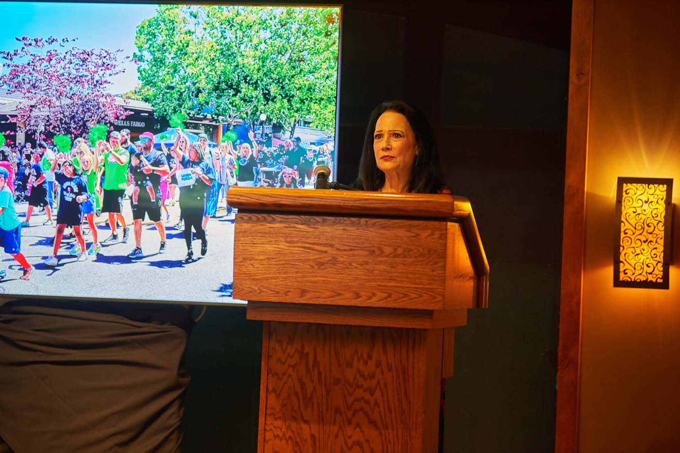 a woman in front of a podium