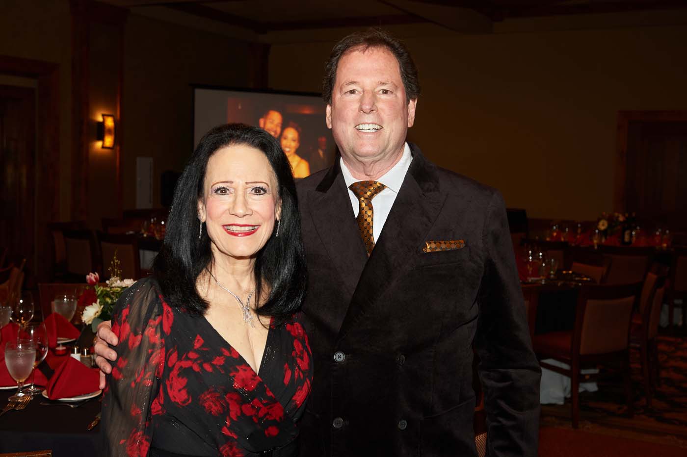 a man and a woman smiling together