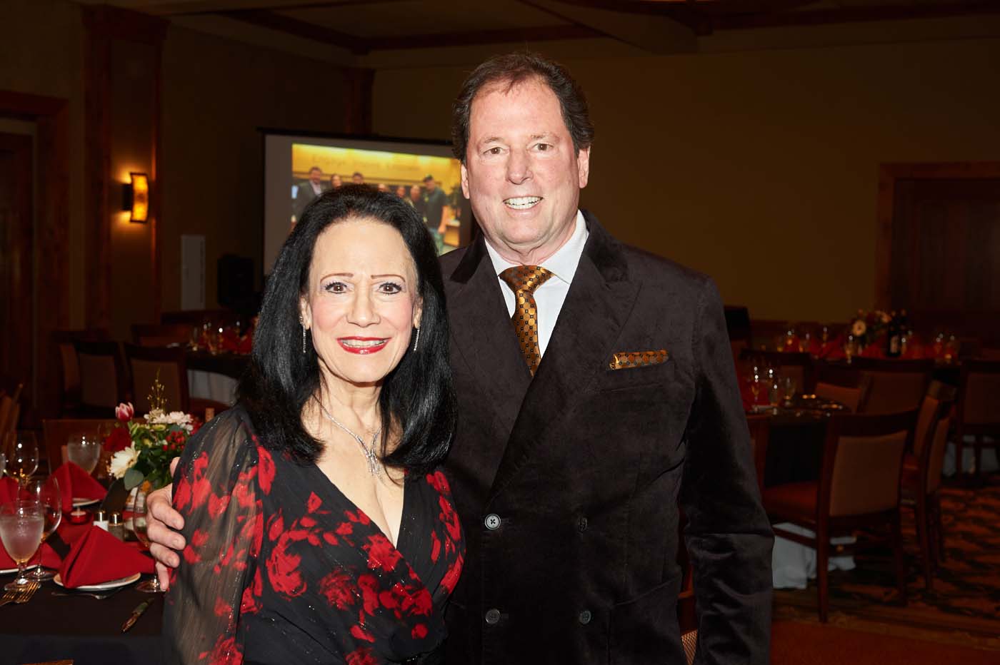 a man and a woman smiling together