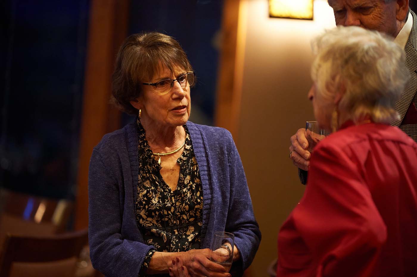 two women standing and talking to each other