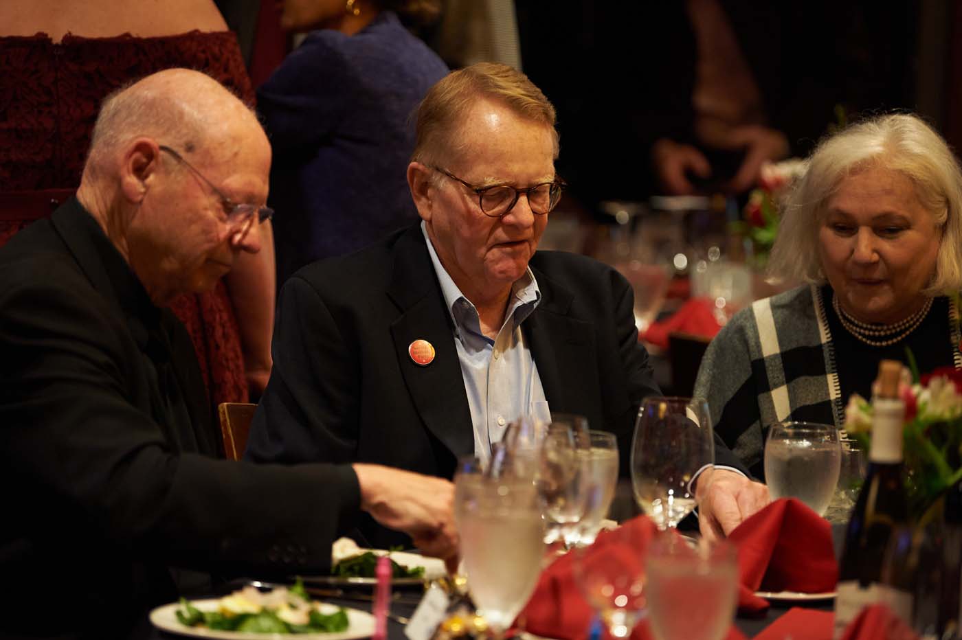 three people seated at a table