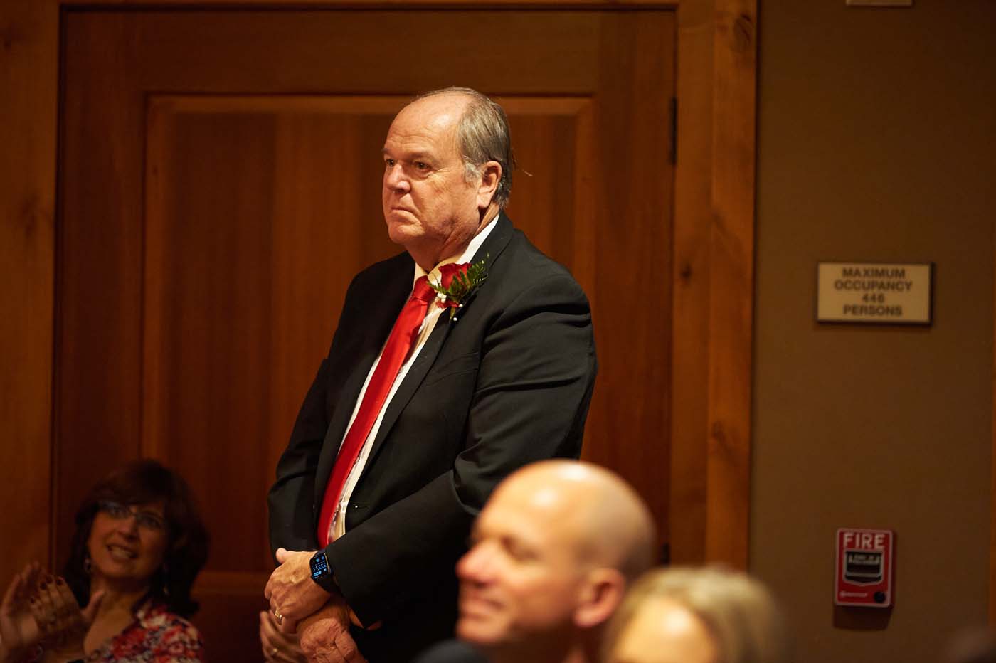 a man in a suit standing